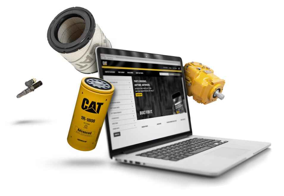 Caterpillar equipment parts floating around a laptop on a white background